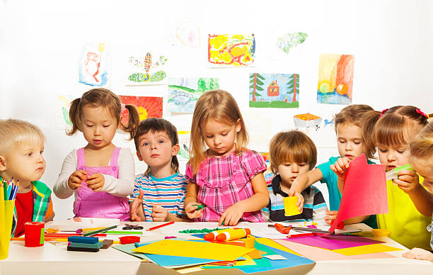 Large group of kids of little boys and girls on the art lesson class